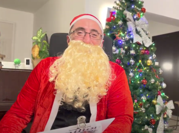 Andrew dressed as Father Christmas